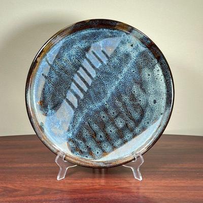 ART POTTERY PLATE  |  
Decorative glazed plate with abstract design, No apparent signature - dia. 11.5 in.