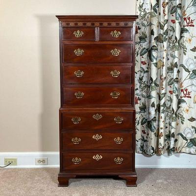 BAKER NARROW DRESSER  |
Designed in two sections, appearing to be of one piece construction, the upper section with two drawers over...