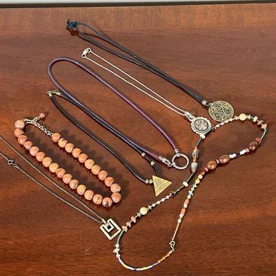 SILVER & OTHER JEWELRY  |
Including a sterling silver chain, a wood beaded necklace, a multi beaded necklace, and others