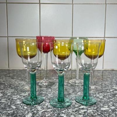 (8pc) MISC COLORED GLASS STEMWARE  |
Miscellaneous glass stemware, including three with yellow cups, three with green stems, one with a...