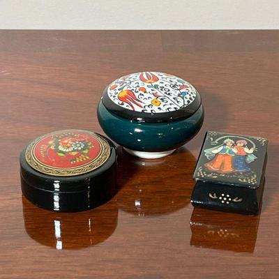 (3pc) RUSSIAN BOXES  |
Including a handmade porcelain litter box, and two lacquered litter boxes, one signed on the bottom - dia. 2.75...