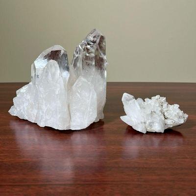 (2pc) GEODES  |  
Two raw crystals. One appearing to have a pink tint, the other one clear - h. 4 1/4 in. (tallest)