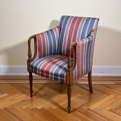UPHOLSTERED ARMCHAIR  |  
With Hickory North Carolina label on the bottom, having striped upholstery on a bent and carved wood frame with...