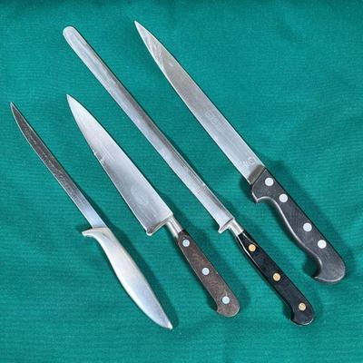 (4pc) CHEF'S KNIVES  |
Including a Charles Menere knife, a Coricama slicer, a Salatier Trumpet knife, and a Gerber Durendal knife -...