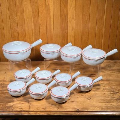 (11pc) D'AUTEUIL COVERED BOWLS  |
Covered handled bowls, including one of large size (l. 12 in.), three smaller bowls, and seven...