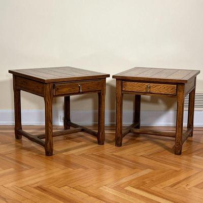 (2pc) PAIR BAKER SIDE TABLES  |
Wooden end tables with a single drawer, with Baker furniture tag - l. 26 x w. 24 x h. 24 in.