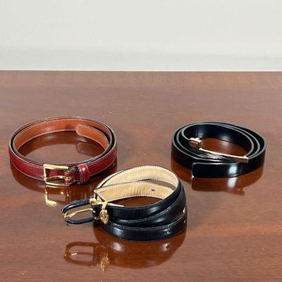 (3pc) DESIGNER BELTS  |
Lady's leather designer belts, including a shiny black Gucci belt, 32 inches, a black aniline cowhide...