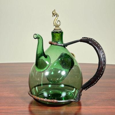 UNUSUAL GREEN GLASS POT  |  
Green Italian pot with a brass and cork stopper - h. 10 1/2 in.