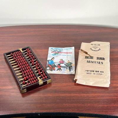 CHINESE ABACUS  |
Diamond brand Chinese abacus with instructions on bead math - l. 10 x w. 5 in.