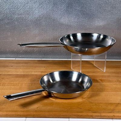 (2pc) STAINLESS FRYING PANS  |
Stainless steel cookware, including a small Cuisinart frying pan (dia. 8.25 in.) and a larger unmarked...