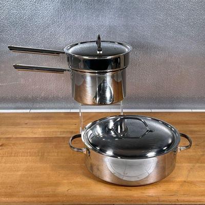 (2pc) CUISINART COOKWARE  |
Stainless steel pots, including a steaming pot with lid, and a large double handled pot also with lid (dia....