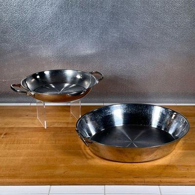 (2pc) ROASTING PANS  |
Including a Cuisinart Pennsylvania Dutch oval roasting pan (3-1/2 qt) and an unmarked stainless steel double...