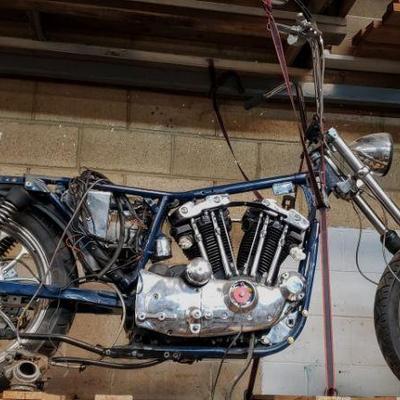 Harley-Davidson motorcycle with extra parts. Bike needs attention.