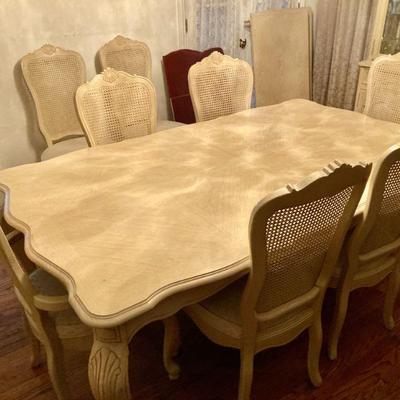 1990s white oak French country style dining set with two leaves, six side chairs, two captain's chairs and custom table pads