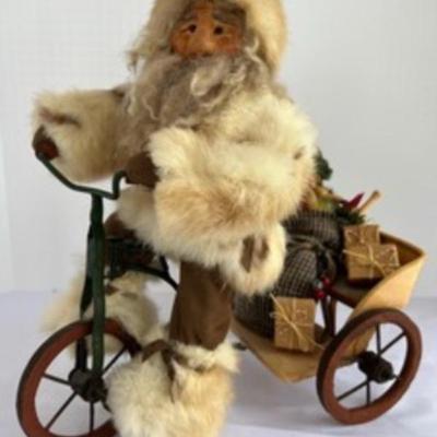 Klausmen Collection Edge-on-Wood Co.

Santa is bringing his gifts in the peddlecart.

Measures 13 inches

1994 #33 Recycled fur and hand...