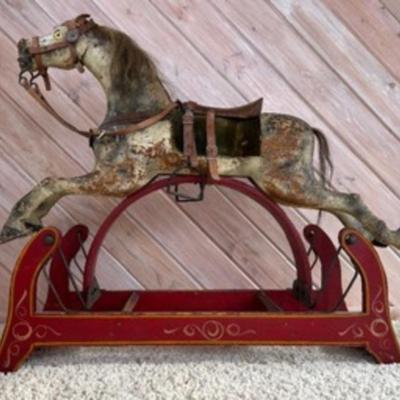 Antique Primitive Carved Wood Rocking Hobby Horse

The piece features a carved wooden horse with real horsehair accents set on top of a...