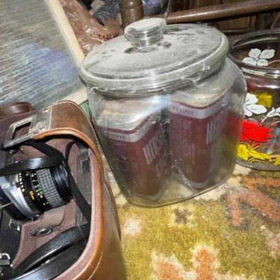 Vintage glass jar with Hersheyâ€™s cocoa cans inside
