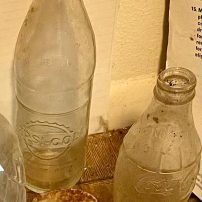 Vintage Pepsi and Coca-Cola bottles