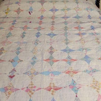 Lot 222 Handmade Quilt
 being displayed on a full size bed which is NOT included, has some fraying.
