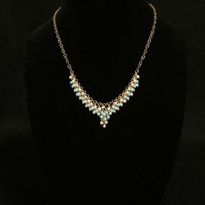 1201	14KT YELLOW GOLD NECKLACE W/BLUE & WHITE BEADS, 7.65 DWTS, APPROXIMATELY 19 IN LONG
