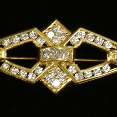 1183	18K YELLOW GOLD BROOCH PIN CONTAINING APP. 1 CARATS OF DIAMONDS. OVERALL WEIGHT 5.65 DWT
