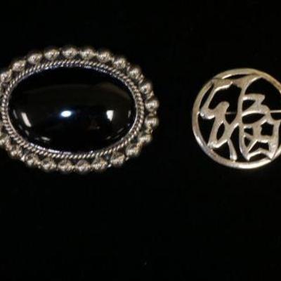 1233	4 STERLING SILVER BROOCHES/PINS INCLUDING ONE W/BLACK ONYX STONE APPROXIMATELY 2 1/4 IN WIDE
