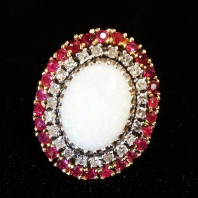 1229	BEAUTIFUL 12KT YELLOW GOLD RING W/OVAL WHITE OPAL CENTER STONE & RUBIES, 10.9 DWT W/STONES, RING SIZE APPROXIMATELY 5 3/4
