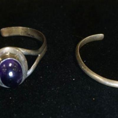 1313	2 STERLING SILVER CUFF BRACELETS INCLUDES ONE CONTAINING AMETHYST & ONE MARKED HAND MADE, 1.051 OZT INCLUDING STONES
