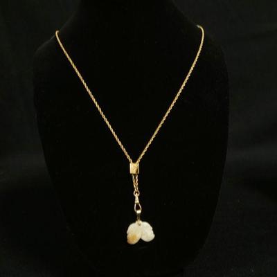 1190	14K GOLD CARVED JADE PENDANT W/ GOLD FILLED CHAIN. CHAIN APP. 28 IN L 
