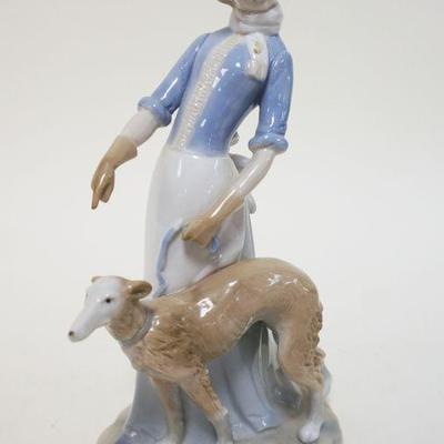 1025	KPM CONTEMPORARY PORCELAIN FIGURE OF WOMAN WALKING A DOG, APPROXIMATELY 8 3/4 IN HIGH
