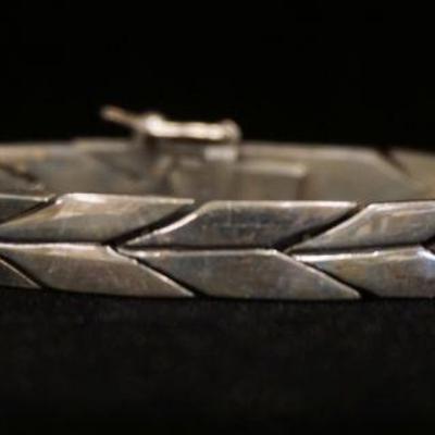 1244	STERLING SILVER BRACELET MARKED MEXICO, APPROXIMATELY 8 1/4 IN LONG, 1.723 OZT

