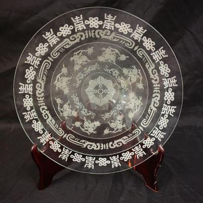 1116	WHEEL CUT ASIAN DESIGN NEST OF 5 PLATES IN BACK GIVING IT A MULTIDIMENTIONAL LOOK, APPROXIMATELY 16 IN X 17 1/2 IN HIGH
