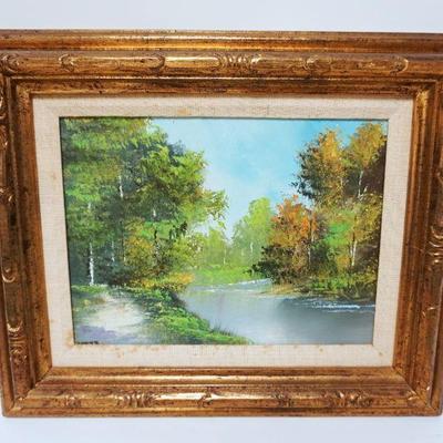1082	FRAMED OIL PAINTING ON CANVAS OF STREAM & WOODS, APPROXIMATELY 14 IN X 17 IN OVERALL
