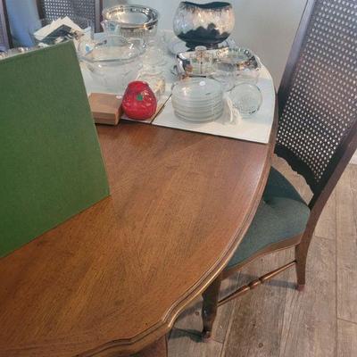 Dining room table with 10 chairs and a table top protector, excellent condition
