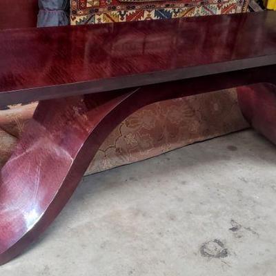 Solid, heavy bent wood designer console table.