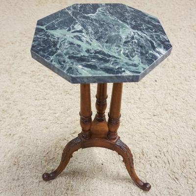 1016	ORNATE CARVED MAHOGANY STAND W/GREEN OCTAGON MARBLE TOP, APPROXIMATELY 13 IN X 26 IN HIGH
