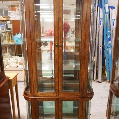 1032	CURVED GLASS MIRRORED BACK CRYSTAL CURIO CABINET W/BEVELED GLASS DOORS & INTERIOR LIGHTS, APPROXIMATELY 36 IN X 12 IN X 76 IN HIGH

