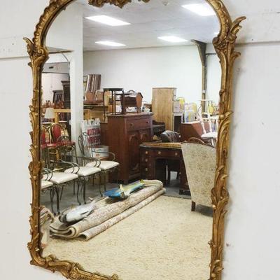 1020	DECORATIVE ARTS INC MIRROR IN ORNATE GILT DECORATED FRAME, APPROXIMATELY 37 IN X 50 IN
