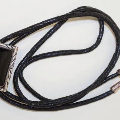 1127	NAKAI STERLING SILVER & BLACK ONYX BOLO TIE, SIGNED NAKAI UNDER CLASP, APPROXIMATELY 38 IN LONG
