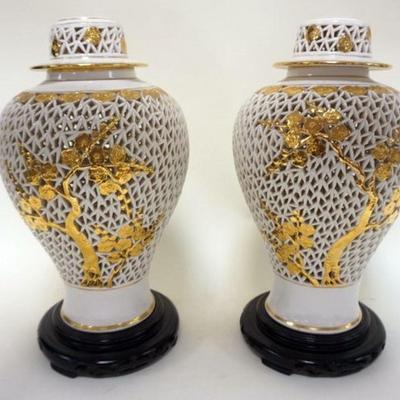 1241	PAIROF ASIAN PIERCED COVERED URNS WITH GILT ACCENTS ON WOOD BASES, CONVERTED TO BECOME LAMPS, APPROXIMATELY 17 IN H
