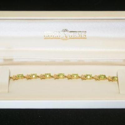 1130	14K YELLOW GOLD BRACELET W/GREEN GEMSTONES, 4.5 DWT INCLUDING STONES, APPROXIMATELY 7 1/2 IN LONG
