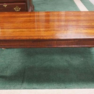 1029	SOLID CHERRY QUEEN ANNE STYLE COFFEE TABLE, APPROXIMATELY 22 IN X 42 IN X 17 IN HIGH
