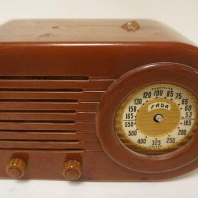 1294	FADA BUTTERSCOTCH CATLIN RADIO, HANDLE MISSING AND BEZE; & DIAL MISSING, UNTESTED AND SOLD AS IS
