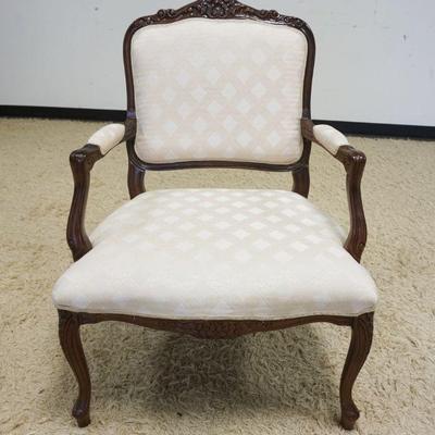1004	CARVED MAHOGANY FRENCH PROVINCIAL ARMCHAIR, UPHOLSTERED
