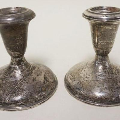 1235	PAIR OF STERLING WEIGHTED 3 1/2 IN CANDLE STICKS
