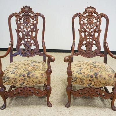 1015	PAIR OF HEAVILY CARVED MAHOGANY ARMCHAIRS W/UPHOLSTERED SEATS
