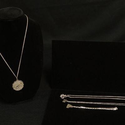 1146	FOUR STERLING SILVER NECKLACES. LONGEST CHAIN APP. 24 IN. 1.653 TROY OUNCES OVERALL
