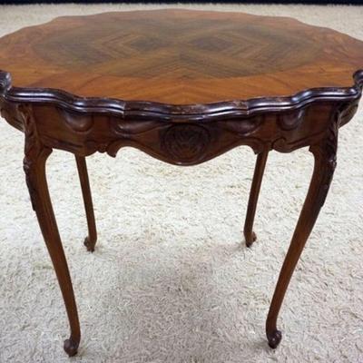 1173	CARVED WALNUT LAMP TABLE WITH DIAMOND INLAY VENEER TOP, APPROXIMATELY 22 IN X 31 IN X 30 IN H
