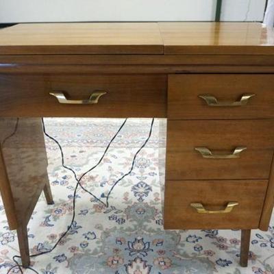 1174	BROTHER SEWING MACHINE IN MID CENTURY MODERN STAND WITH DRAWERS, APPROXIMATELY 35 IN X 18 IN X 31 IN H

