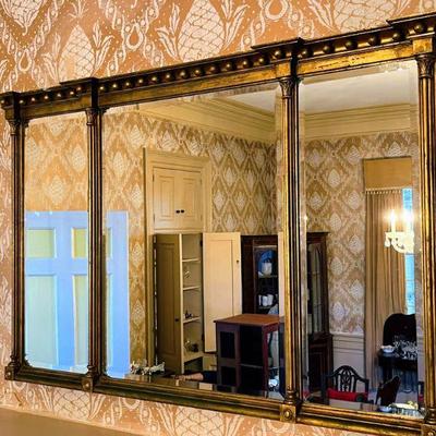 Massive landscape wall mirror with three beveled panels. Gilt-wood. Early 19th Century Neo-Classical style. 